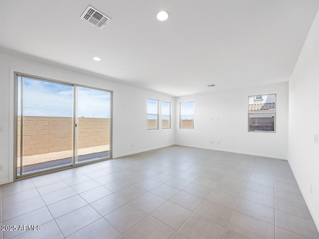14634 W Sand Hills Rd, Surprise, AZ 85387 - tiled empty room featuring recessed lighting and baseboards