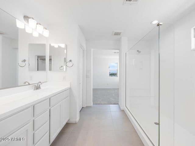 14634 W Sand Hills Rd, Surprise, AZ 85387 - full bathroom with tile patterned flooring, vanity, walk in shower, and baseboards