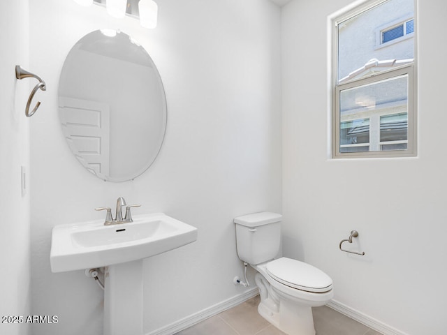14634 W Sand Hills Rd, Surprise, AZ 85387 - bathroom with baseboards, toilet, and tile patterned floors