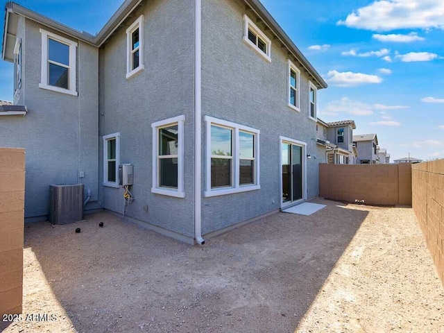 14634 W Sand Hills Rd, Surprise, AZ 85387 - rear view of house featuring cooling unit, a fenced backyard, and stucco siding