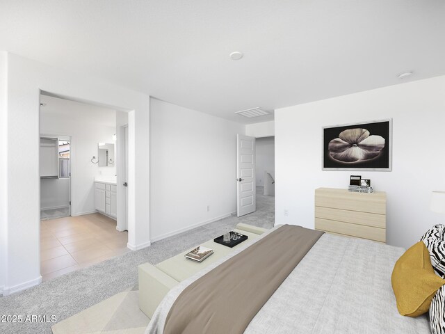 14634 W Sand Hills Rd, Surprise, AZ 85387 - tiled bedroom with carpet, baseboards, and connected bathroom