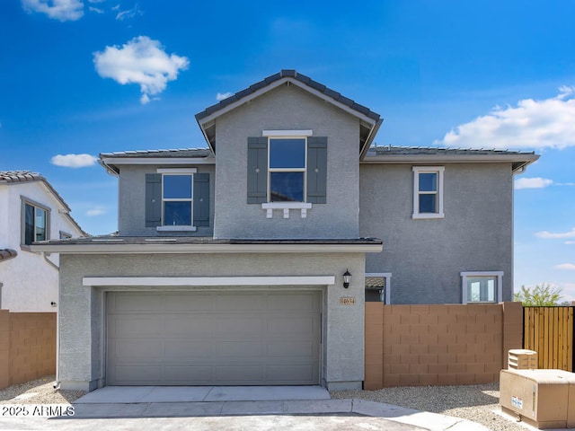 14634 W Sand Hills Rd, Surprise, AZ 85387 - traditional-style house with fence, a garage, stucco siding, and a tiled roof