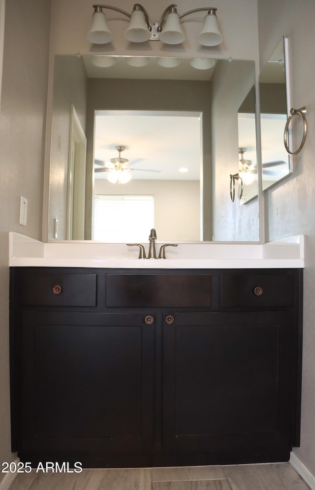 bathroom featuring vanity and ceiling fan