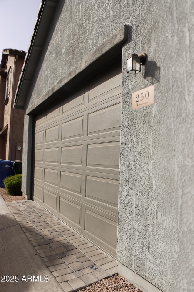 garage featuring driveway