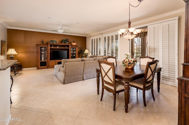 dining room with crown molding, light tile flooring, and ceiling fan with notable chandelier