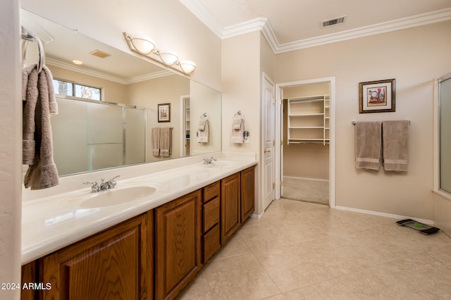 bathroom with crown molding, double sink vanity, and tile floors