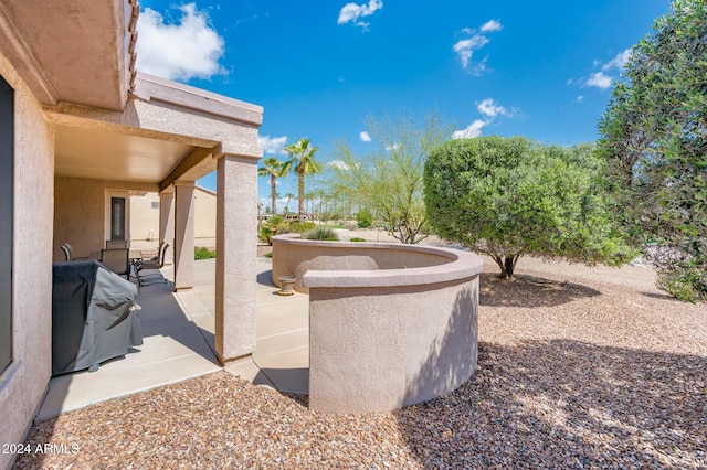 view of patio with a grill