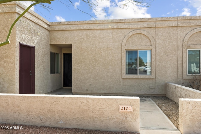 exterior space featuring stucco siding