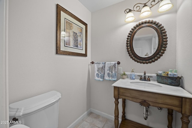 bathroom featuring sink and toilet