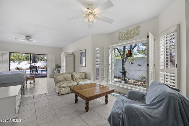 tiled living room featuring ceiling fan