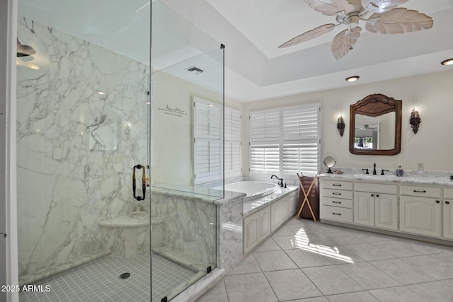 bathroom featuring shower with separate bathtub, tile patterned floors, ceiling fan, and vanity