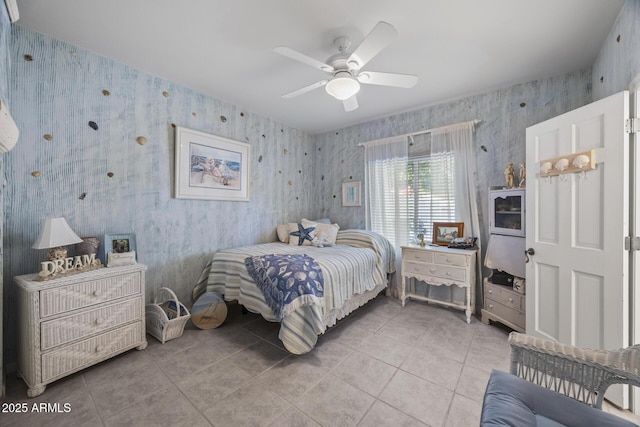 tiled bedroom featuring ceiling fan