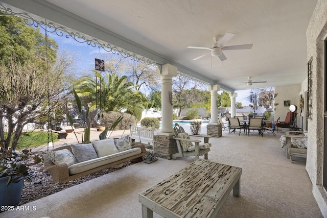 view of patio with ceiling fan, an outdoor hangout area, and a fenced in pool