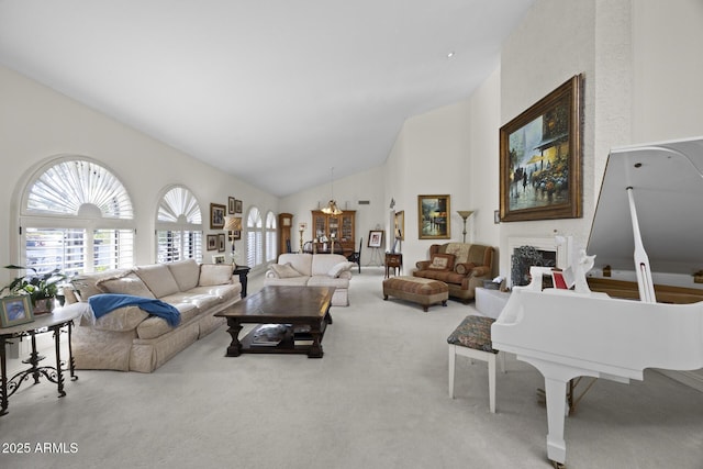 carpeted living room featuring high vaulted ceiling