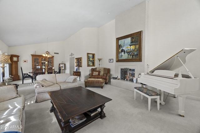 living room with an inviting chandelier, light colored carpet, and high vaulted ceiling