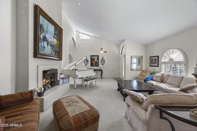 living room featuring high vaulted ceiling and light carpet