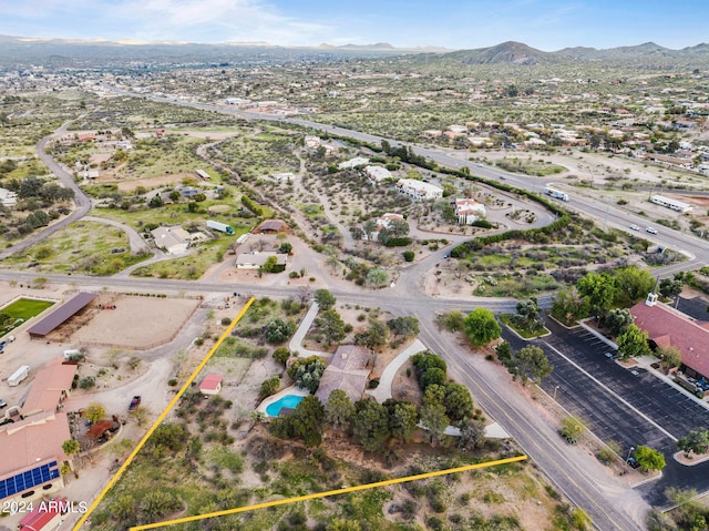 birds eye view of property featuring a mountain view