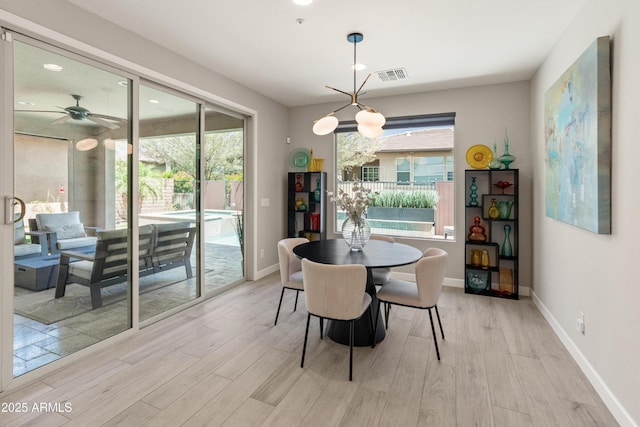 13186 W Via Dona Rd, Peoria, AZ 85383 - dining area featuring light wood finished floors, baseboards, and a ceiling fan