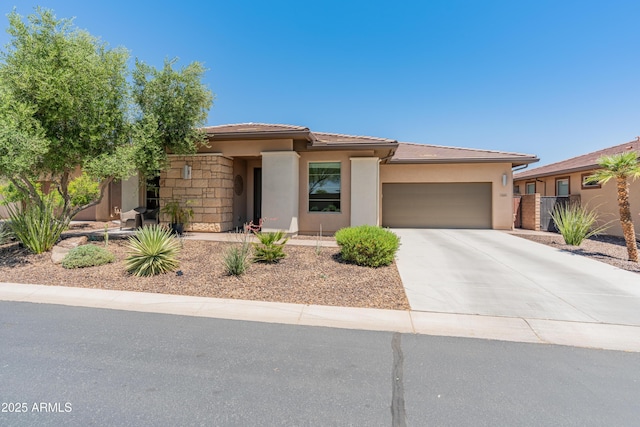 13186 W Via Dona Rd, Peoria, AZ 85383 - prairie-style house featuring an attached garage, stucco siding, driveway, and a tiled roof