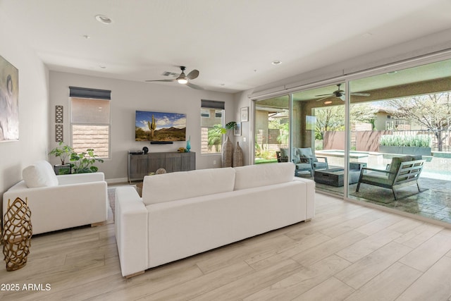 13186 W Via Dona Rd, Peoria, AZ 85383 - living area with a ceiling fan, light wood-style flooring, and recessed lighting