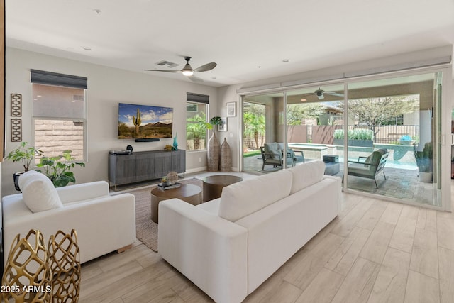 13186 W Via Dona Rd, Peoria, AZ 85383 - living area with a ceiling fan and light wood-type flooring