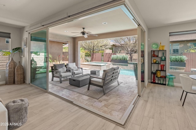 13186 W Via Dona Rd, Peoria, AZ 85383 - living area with wood finished floors, a ceiling fan, and baseboards