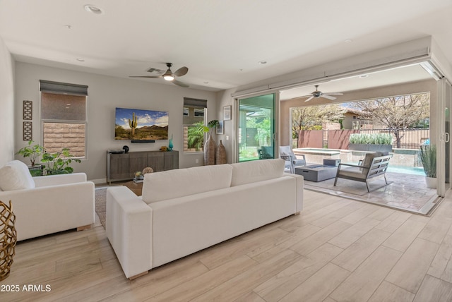 13186 W Via Dona Rd, Peoria, AZ 85383 - living room with a ceiling fan, light wood-type flooring, and recessed lighting