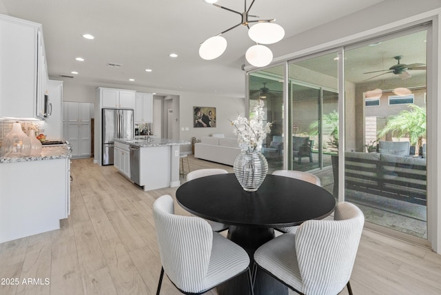 13186 W Via Dona Rd, Peoria, AZ 85383 - dining room with a ceiling fan, light wood-type flooring, and recessed lighting