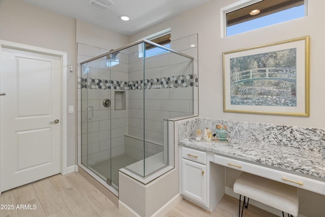 13186 W Via Dona Rd, Peoria, AZ 85383 - full bathroom featuring a shower stall, recessed lighting, wood finished floors, and vanity