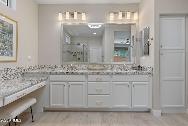 13186 W Via Dona Rd, Peoria, AZ 85383 - full bath featuring a stall shower, double vanity, and wood finished floors