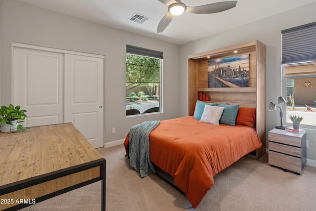 13186 W Via Dona Rd, Peoria, AZ 85383 - bedroom with light carpet, a closet, a ceiling fan, and baseboards