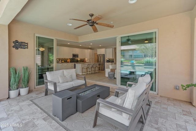 13186 W Via Dona Rd, Peoria, AZ 85383 - view of patio / terrace featuring an outdoor living space with a fire pit and a ceiling fan