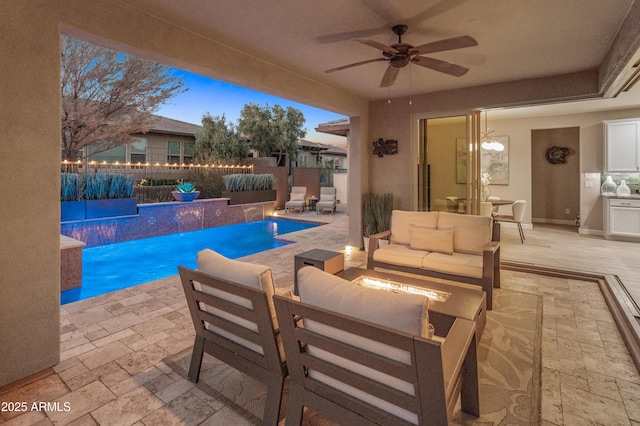 13186 W Via Dona Rd, Peoria, AZ 85383 - view of swimming pool featuring an outdoor living space with a fire pit, a patio, a ceiling fan, and a fenced backyard