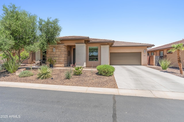 13186 W Via Dona Rd, Peoria, AZ 85383 - prairie-style house featuring stucco siding, an attached garage, driveway, and a tile roof