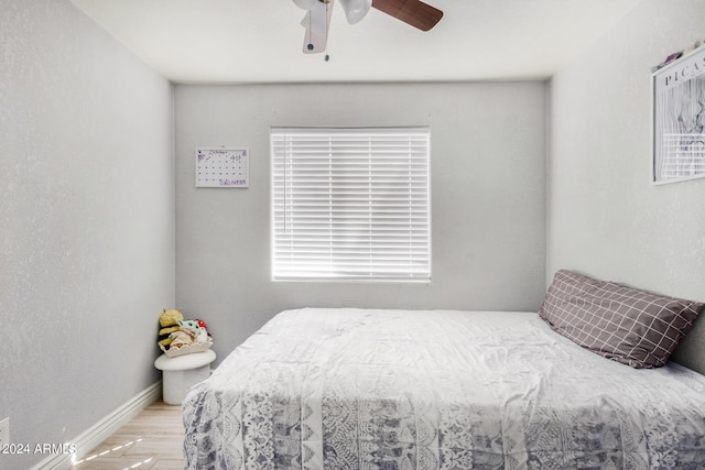 bedroom with light wood-type flooring and ceiling fan