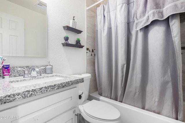 full bathroom featuring shower / tub combo, vanity, and toilet