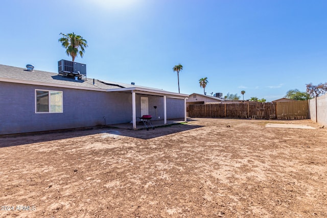 exterior space with cooling unit and a patio