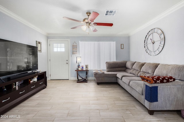 living room with ceiling fan and crown molding