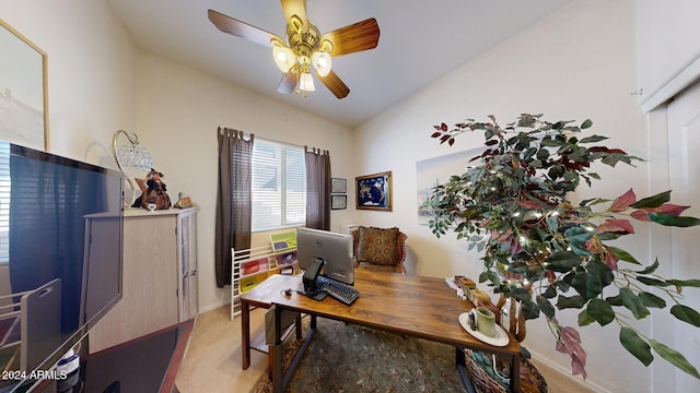 home office featuring ceiling fan and light carpet