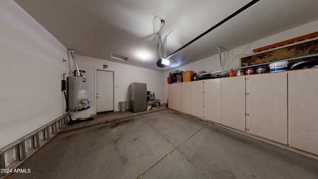 garage featuring a garage door opener and gas water heater