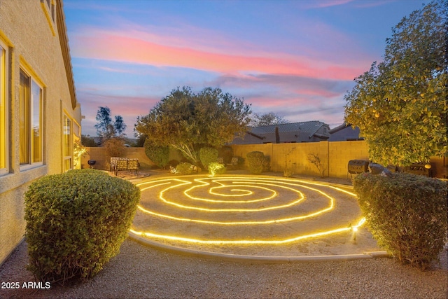 view of yard at dusk