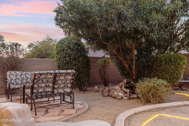 view of patio terrace at dusk