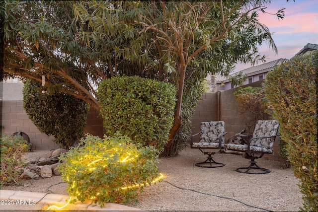 view of patio terrace at dusk