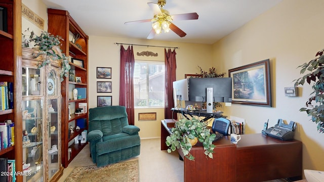 carpeted office with ceiling fan