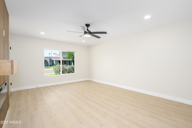 8341 E Keim Dr, Scottsdale, AZ 85250 - unfurnished living room with light wood finished floors, recessed lighting, and a ceiling fan