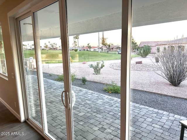 2734 N Trevino Pl, Mesa, AZ 85215 - doorway with dark wood-type flooring and baseboards