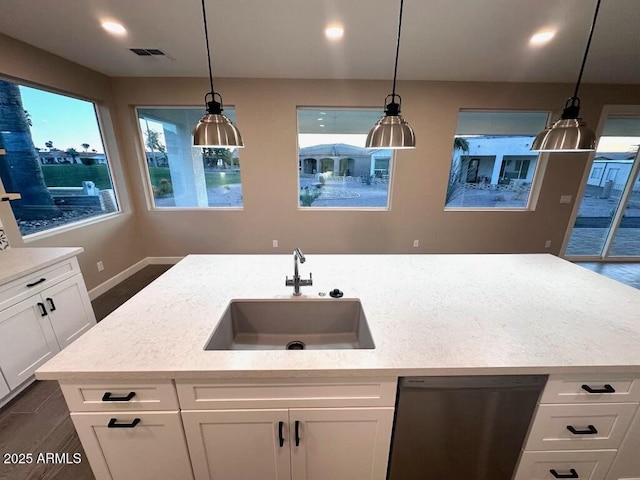 2734 N Trevino Pl, Mesa, AZ 85215 - kitchen with visible vents, hanging light fixtures, white cabinetry, a sink, and dishwasher
