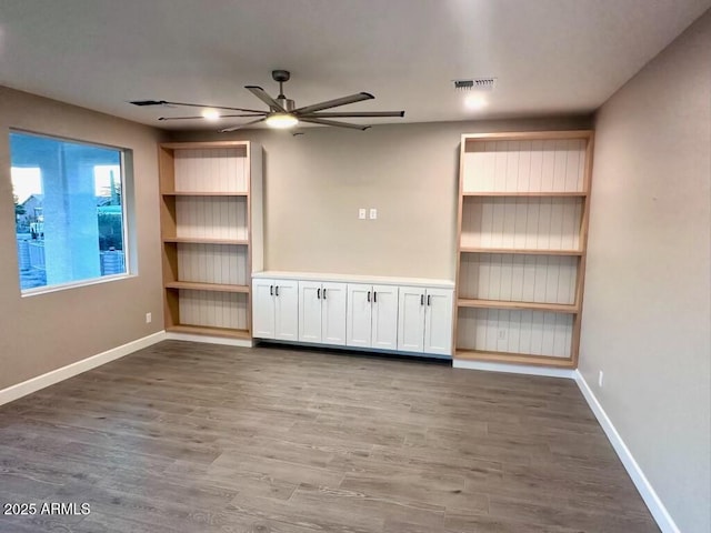 2734 N Trevino Pl, Mesa, AZ 85215 - unfurnished living room featuring a ceiling fan, visible vents, baseboards, and wood finished floors