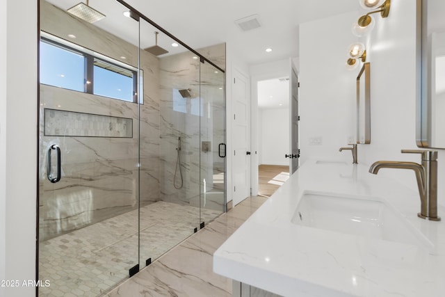 bathroom with vanity and walk in shower