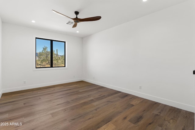 unfurnished room featuring hardwood / wood-style floors and ceiling fan